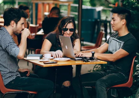 Trusted WiFi shortlisted for Glotel Awards 2023 groupf of people sitting in a cafeteria using wi fi